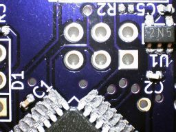 The parts assembled on the solder paste, under a microscope.