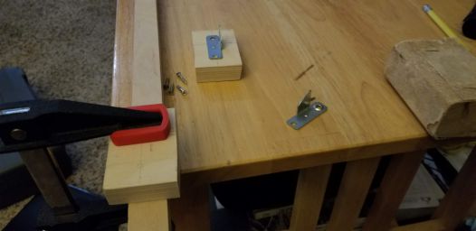 Making the curtain rod clips.