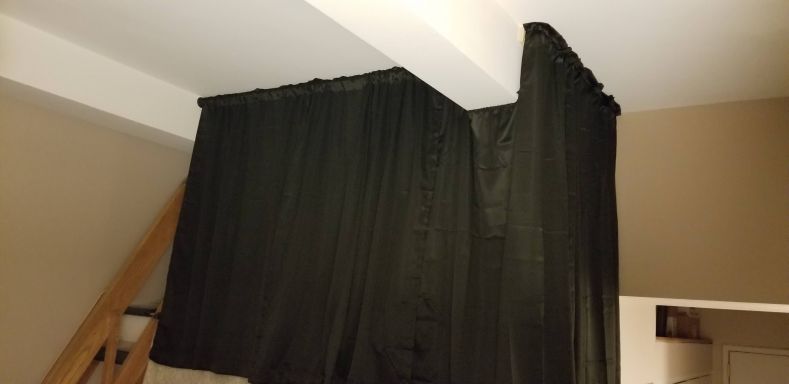 My completed screening curtain, including a dip under the suport beam and a turn around the corner.