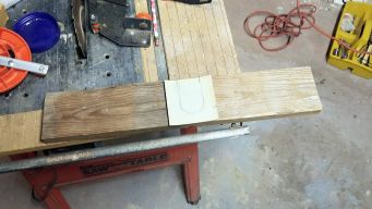 The first board cut to length, with the curtain rod cut-out planned.