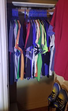 Lots of t-shirts, now hanging from a closet rod.