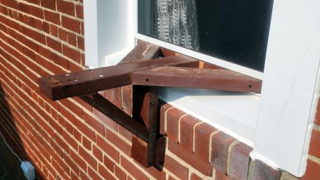 Newly built A/C support bracket, exterior view.