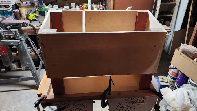 Next phase of assembly: sides are cut down to size and the first part of the roof is assembled.
