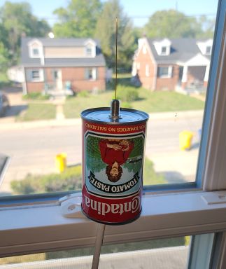 The simple ADS-B antenna I built, sitting in a window.