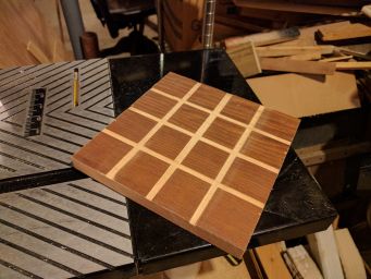 The board is a grid routed into some already-finished wood.