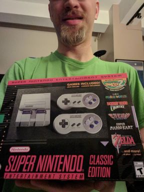 Me proudly holding my SNES Classic.