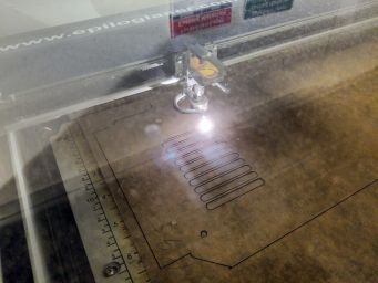 Laser cutting the bottom case part.